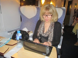 typing up notes on our tablet on the train to Argenton